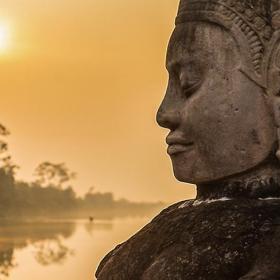 Buddha is shown over a body of water in Angkor Wat, where Projects Abroad volunteers visit and educate themselves on Khmer History