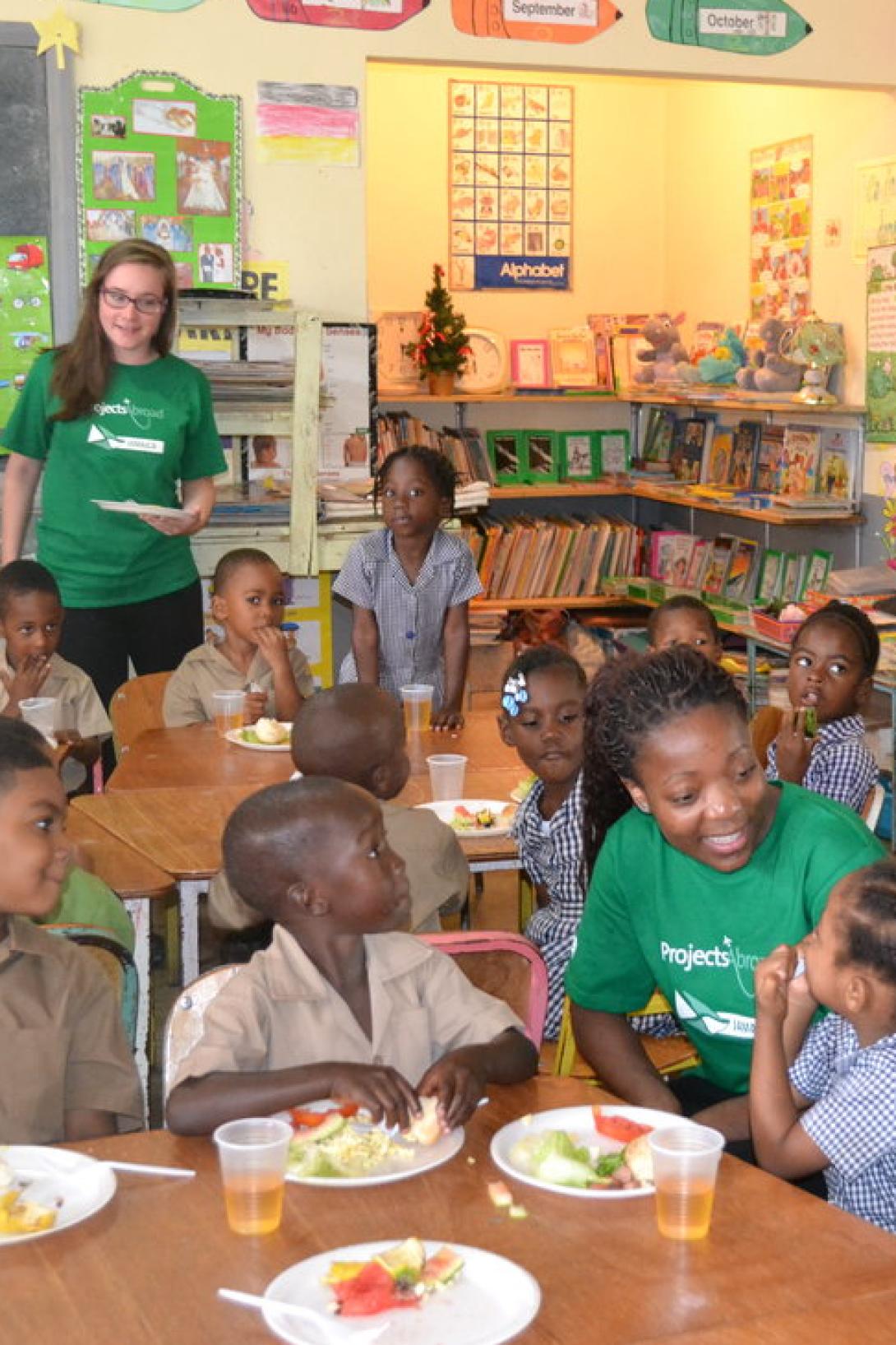 A group of Childcare volunteers in Jamaica prepare a healthy breakfast for children at a disadvantaged school.