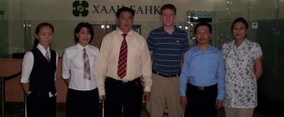 Business Interns pose for a photo with staff at a local bank in Mongolia.