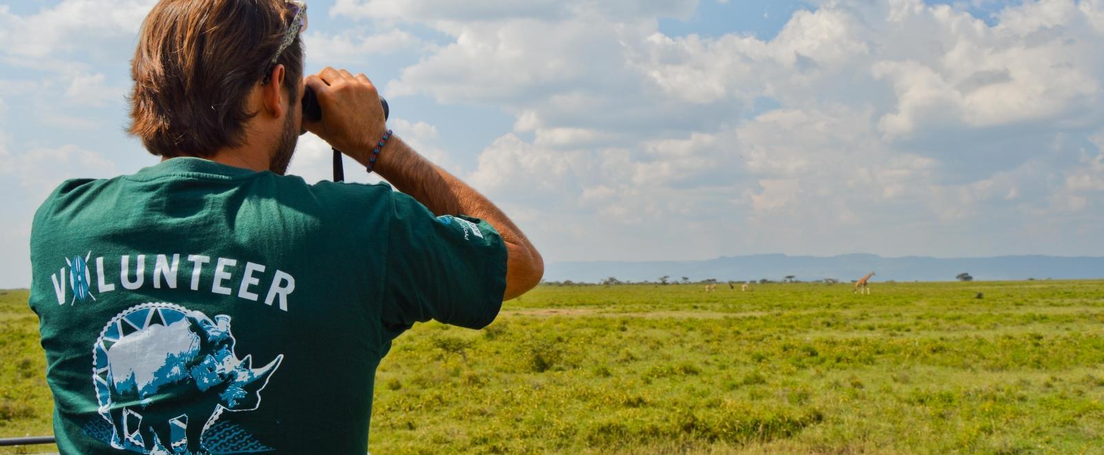 A man conducting a wildlife census as part of Projects Abroad's conservation volunteer work abroad.