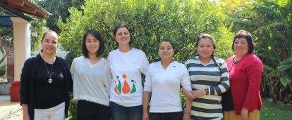 International Development interns pose outside with staff from a women's empowerment organisation in Mexico.