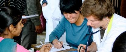 An intern participates in health screenings as part of their medical work experience in Nepal.
