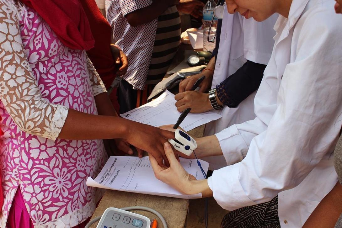 Medical interns abroad check people’s blood pressure during an outreach in Nepal