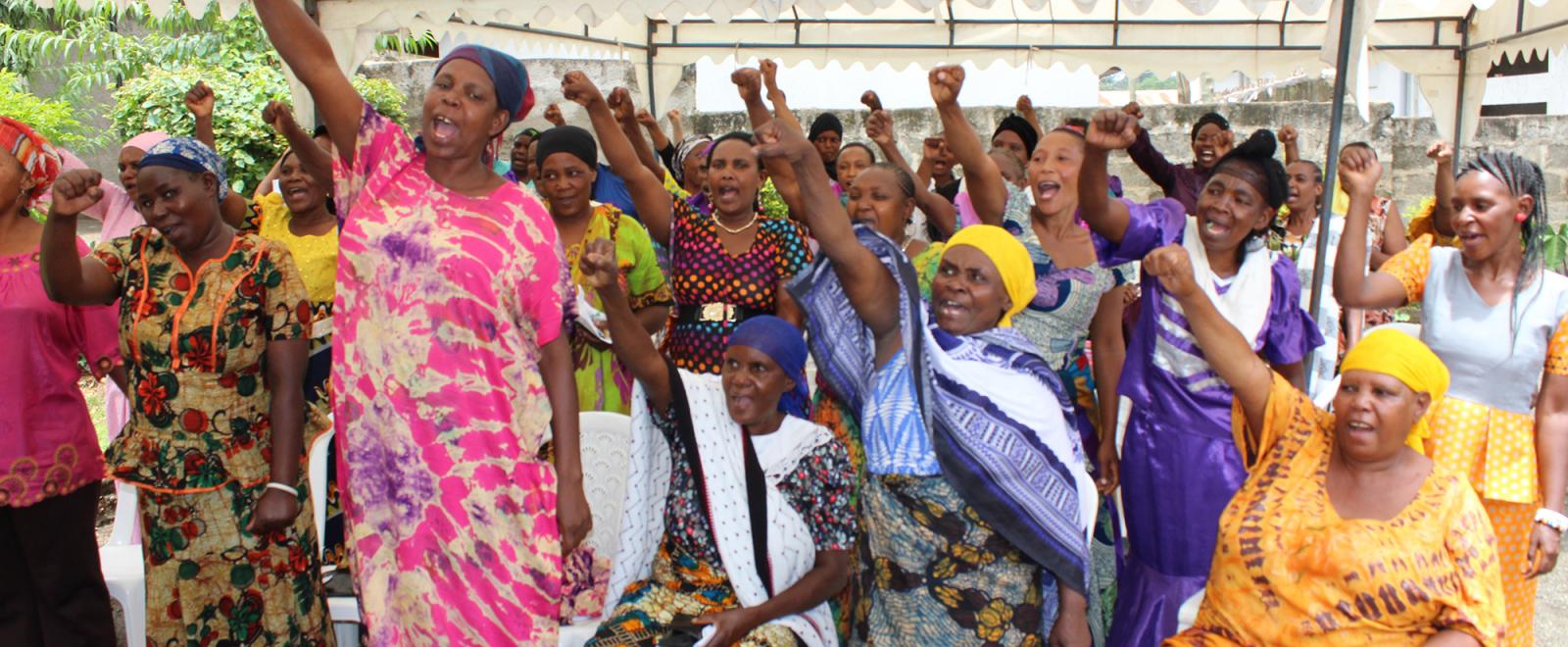 Local women attend an International Women's Day presentation at our women's empowerment program in Africa.