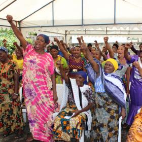 Local women attend an International Women's Day presentation at our women's empowerment program in Africa.