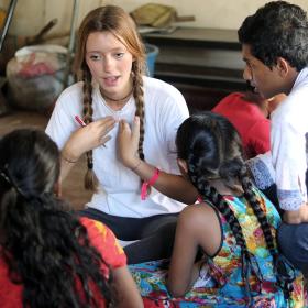 Youth Development volunteer teaches her students how to pronounce English words correctly in Sri Lanka.