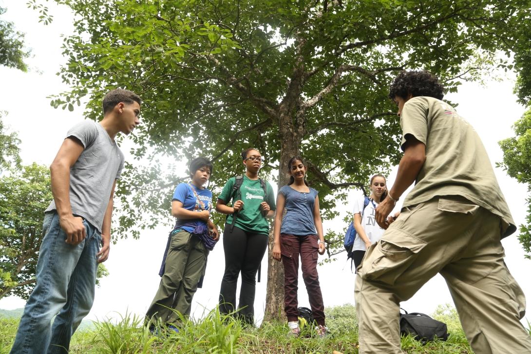 A staff member talks to Conservation volunteers about reforestation in Costa Rica